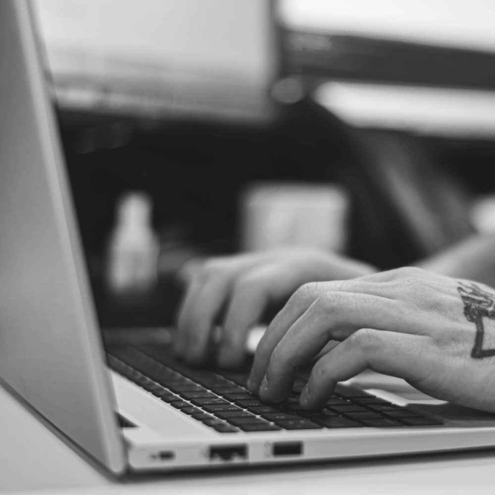 A person typing on a laptop.