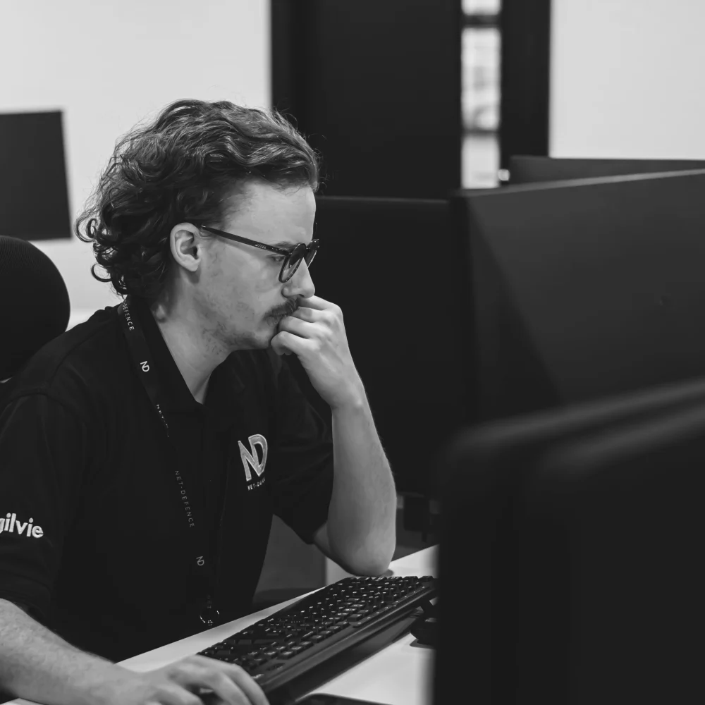 Scott Redpath sat at his desk in the Net-Defence office