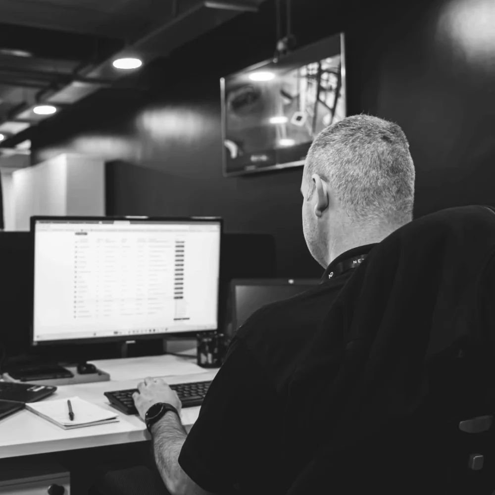 Male worker working on computer in Net-Defence Office