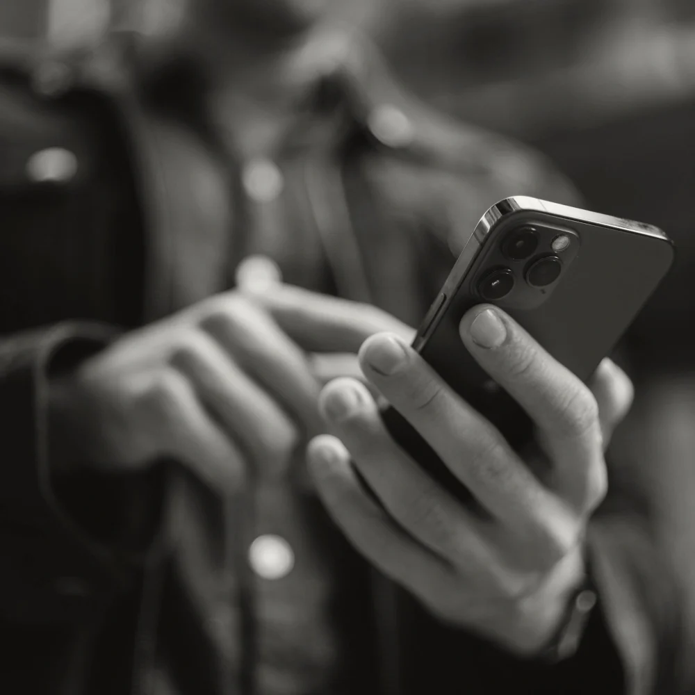 A person holding a modern smartphone.