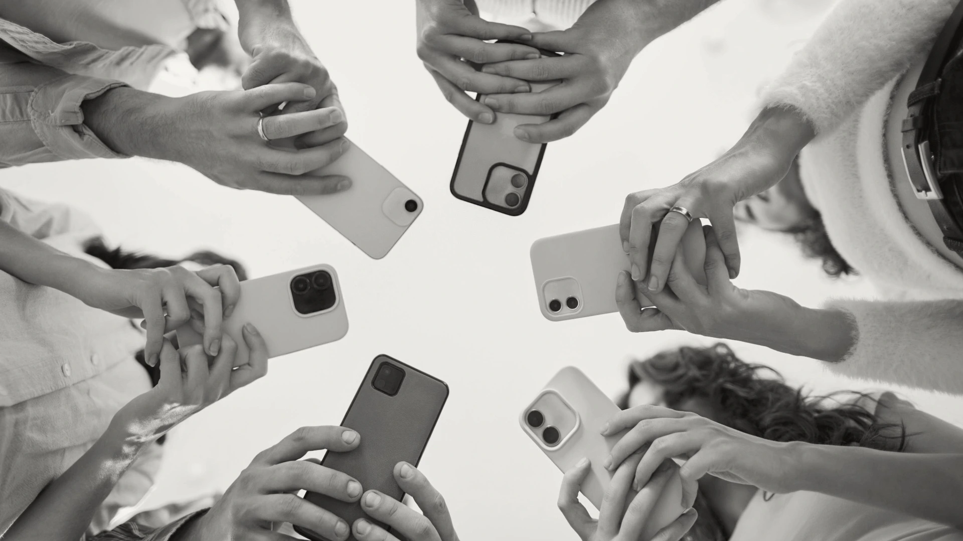 A crowd of people on their phones.