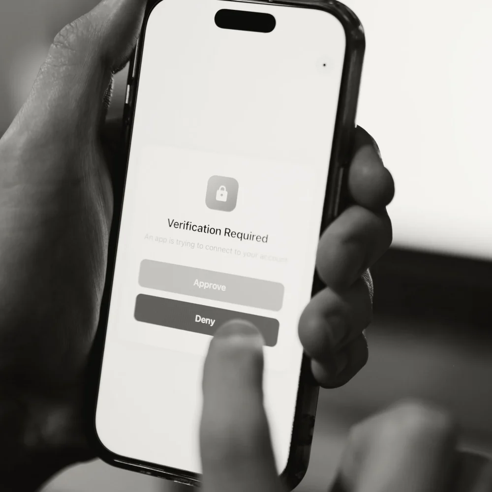 A person using MFA on a smartphone.